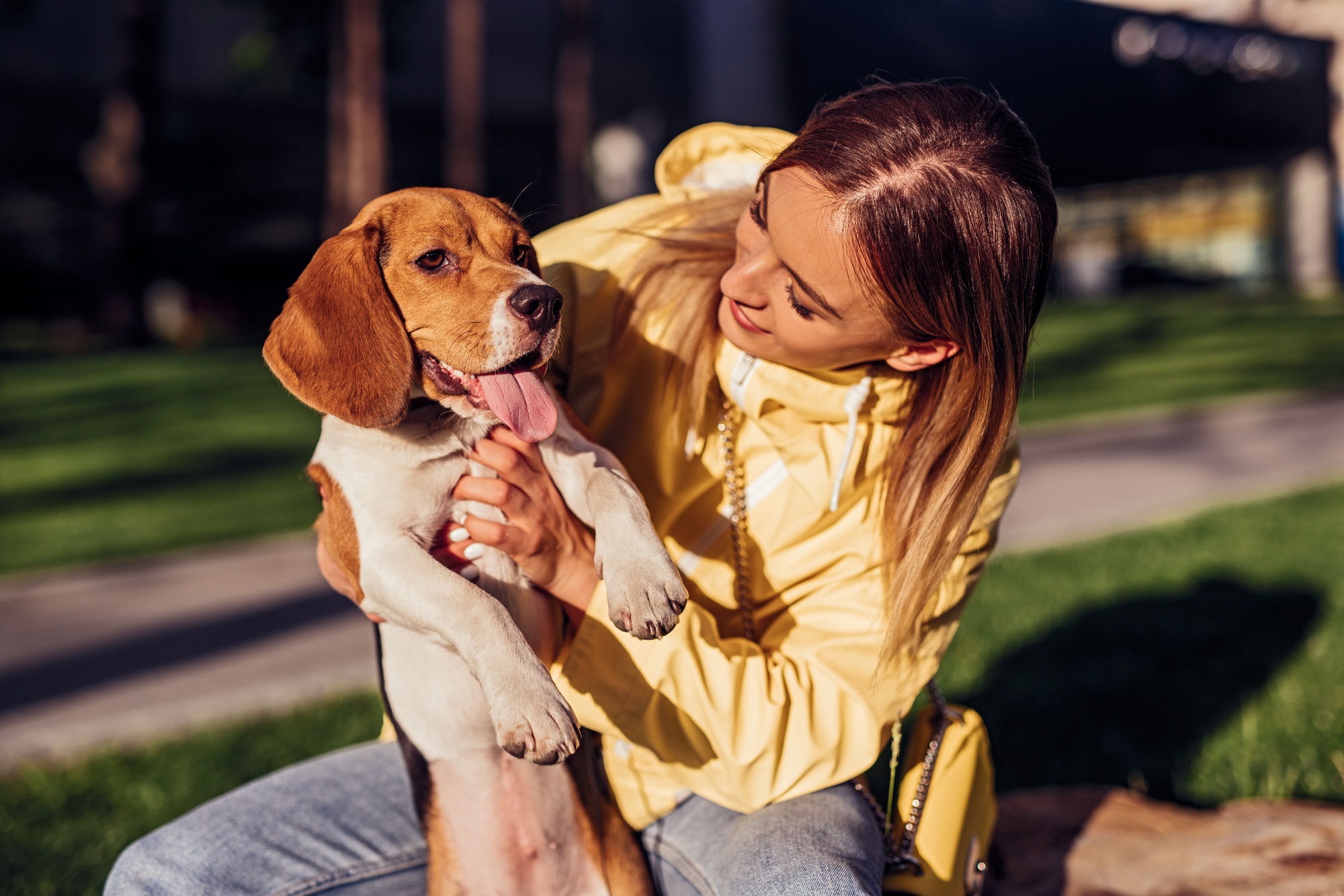 Young woman with dog in park